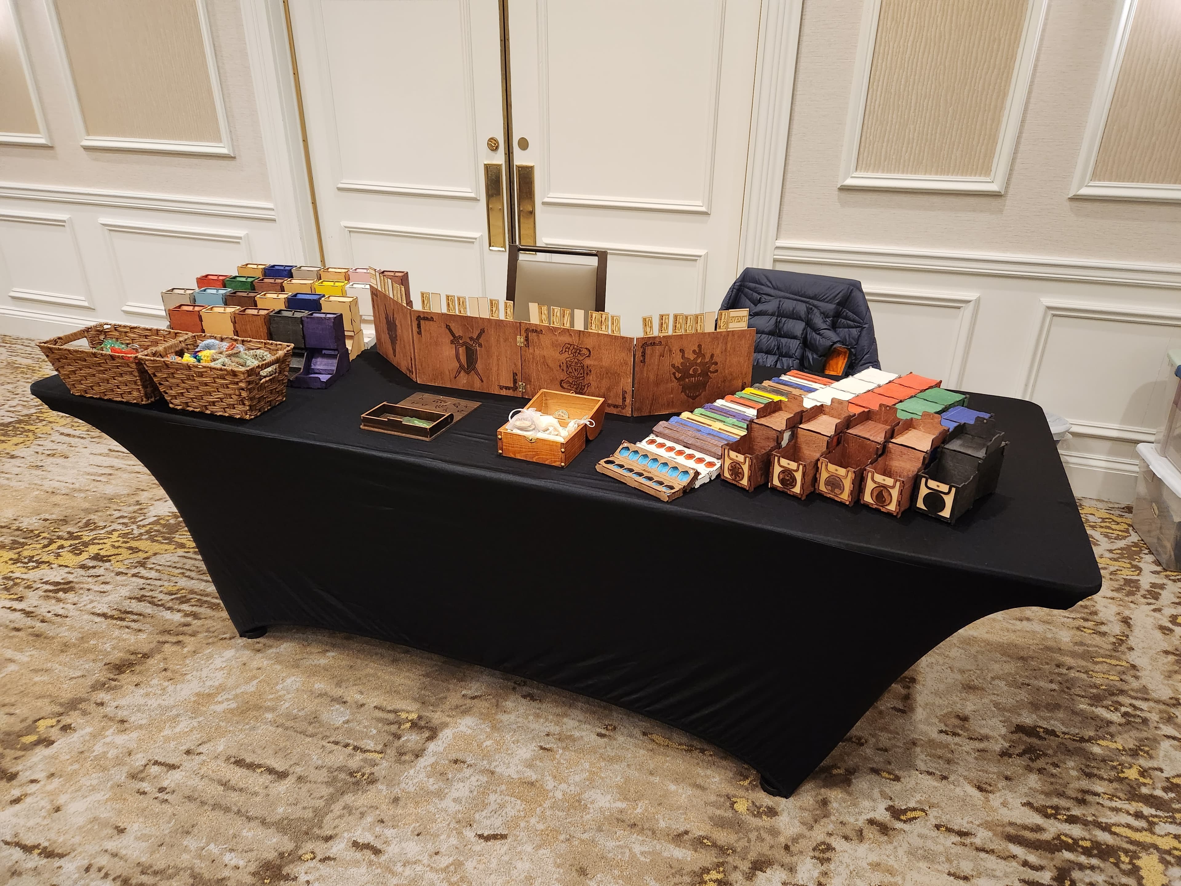 An assortment of our various gaming accessories. Dice towers, dice boxes, deck boxes, and DM screens. Check out our shop to order your own, fully customizable!